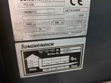 a machine that has a roll of paper on it