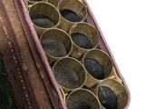 an old suitcase with a bunch of rocks inside of it