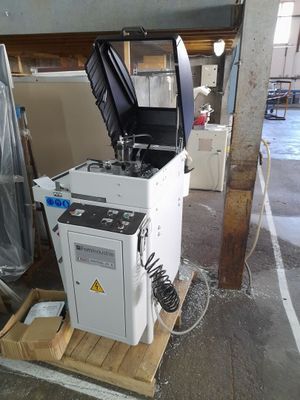 a machine that is sitting on a pallet in a garage