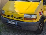 a yellow van parked in front of a building
