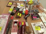 a lot of makeup products on a table that are on the table