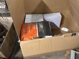 a cardboard box with a bunch of books inside of it