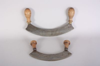 pair of antique wooden handles on a white background
