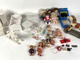 many figurines that are sitting on a white table