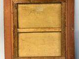 an old wooden picture frame with a painting on it