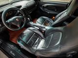 a picture of a car interior with a steering wheel and dashboard