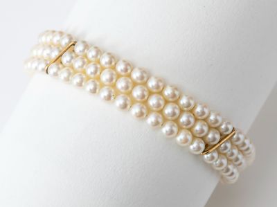 pearl bracelet on a napkin on a white background