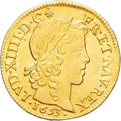 a close up of a gold coin on a white background