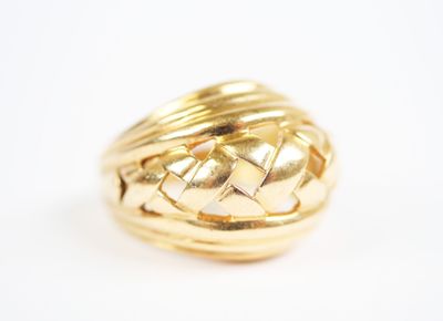 an image of a gold ring on a white surface