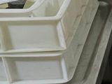 a stack of bins sitting on top of a table