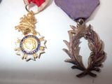 two medals that are on display on a table