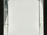 an ornately decorated mirror with a white frame on a black background