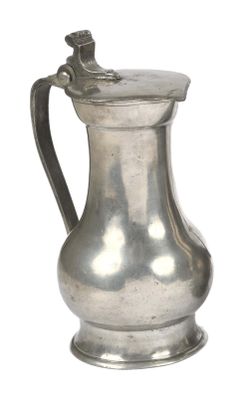 a silver pitcher with a handle on a white background