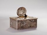 a silver box with a clock on top of it