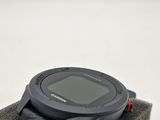 a watch sitting on top of a towel on a table
