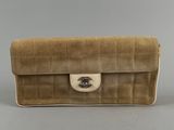 chanel, a beige canvas and leather clutch bag