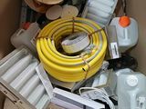 a cardboard box filled with different types of electrical equipment