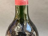 a bottle of wine that is sitting on a table
