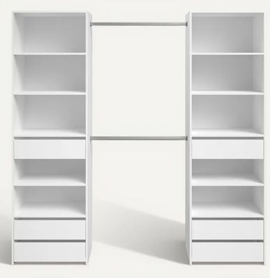 a close up of a white bookcase with drawers and shelves