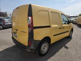 a yellow van that is parked in a parking lot