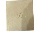 an image of a picture of a gold plate with a monogram