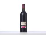a bottle of wine that is sitting on a table