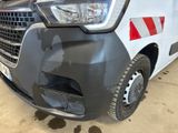a white van with a red stripe on the front of it
