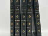 a set of five black books sitting on top of each other