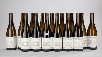 six bottles of wine lined up in a row on a table