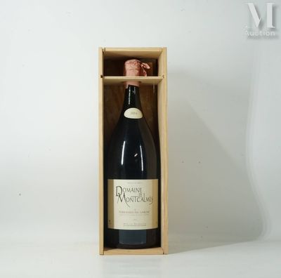 a bottle of wine in a wooden box on a white surface