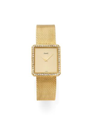 an eighteen karat gold wrist watch with diamond bezel