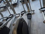 many stationary exercise bikes in a gym room