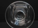 an image of a clear glass vase on a black surface