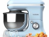 an image of a blue stand mixer with doughnuts in front of it