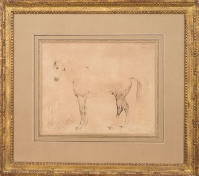 a drawing of a horse in a gold frame on a wall