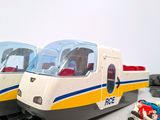 two trains that are sitting next to each other on a table