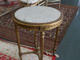 several chairs and a table in a room with a rug on the floor