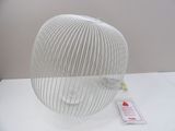 a white object on a table with a red tag on it