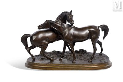 bronze sculpture of two horses standing on a base on a white background