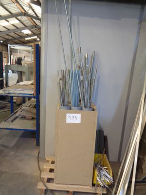 a box with a bunch of metal rods in it