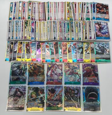 a large collection of pokemon trading cards are displayed on a table