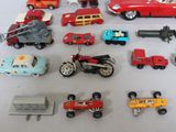 a lot of toy cars and trucks that are on a table