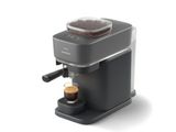 une image représentant une machine à café sur laquelle est posée une tasse de café
