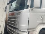 a white truck that is parked next to a building