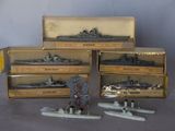 several model ships are in a box on a table