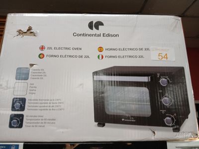 packaging of a black and white microwave sitting on display in a store