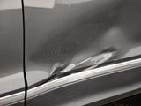 a black and white photo of a car door handle