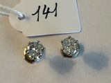pair of diamond stud earrings with price tag on white background