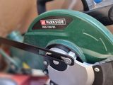 someone is using a circular saw to cut a piece of wood