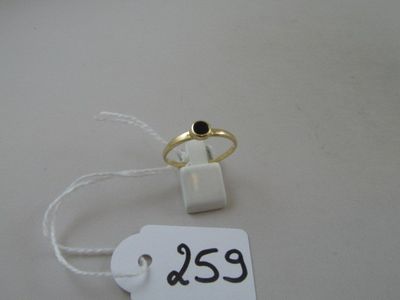 a ring with a black stone on it and a price tag